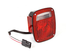 Load image into Gallery viewer, Omix Tail Light Black Housing LH 87-90 Jeep Wrangler